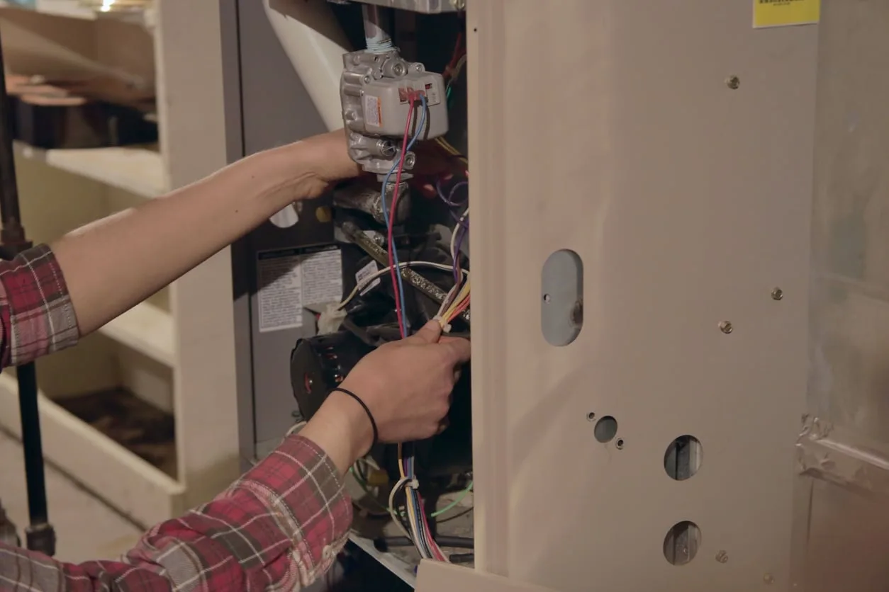 technician working on a furnace